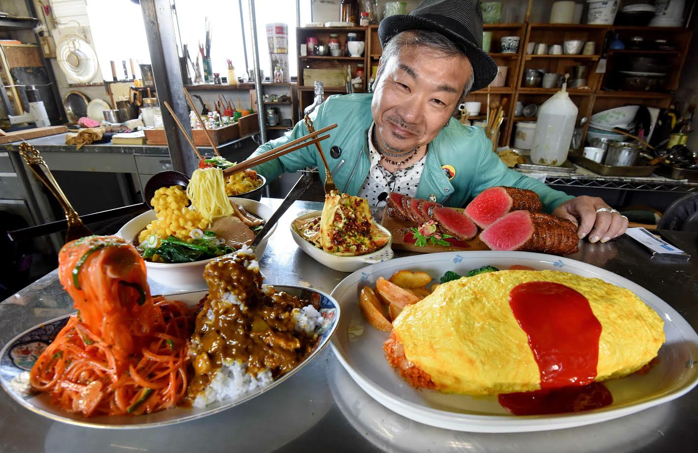 Norihito Hatanaka, president of Fake Food Hatanaka, introducing plastic food dishes at his company's studio in Tokorozawa, a suburb of Tokyo. (AFP)